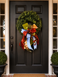Autumn in the South bow with velvet red, olive gold, orange plaid, and powder blue ribbon on a boxwood wreath