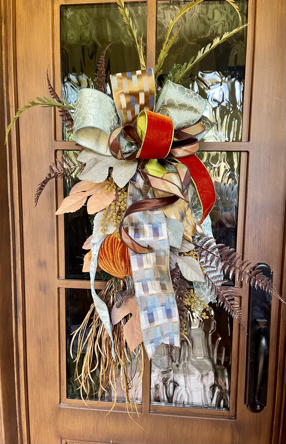 PRE-ORDER | Autumn Estate Fall Door Swag — handcrafted fall door swag with soft blue and neutral ribbon, rust velvet, autumn plaid, velvet pumpkin, and textured fall foliage